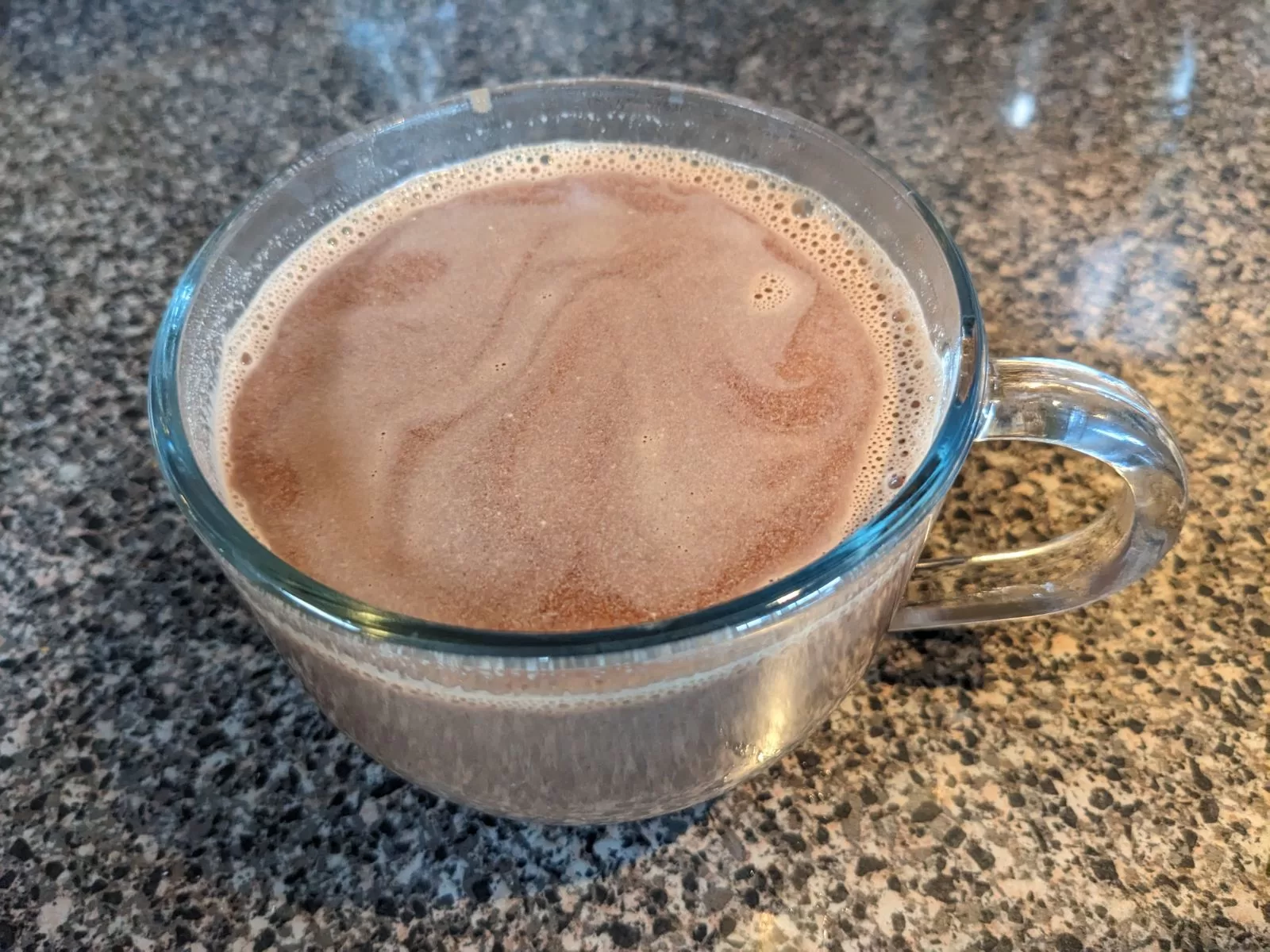 hot chocolate in a glass mug