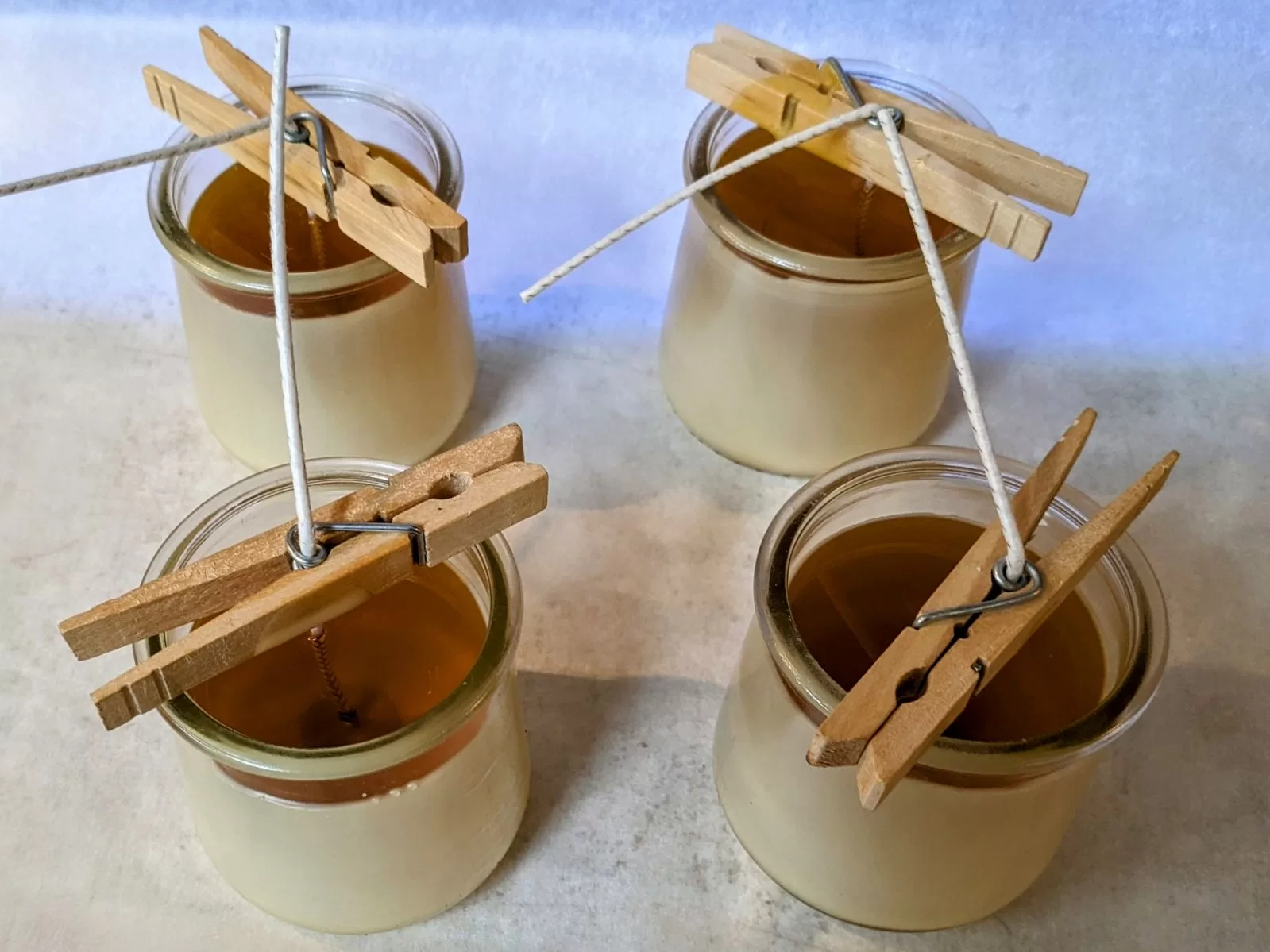 4 beeswax candles cooling