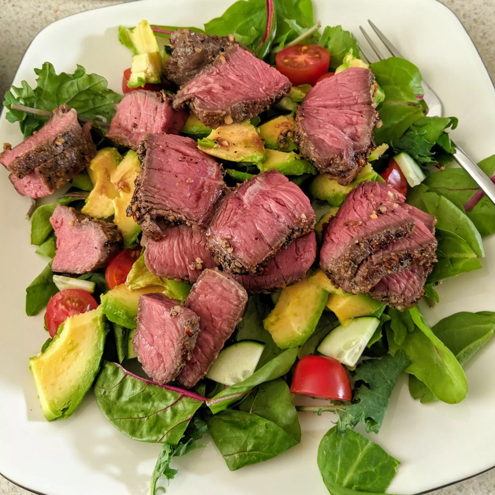 sous vide steak over salad