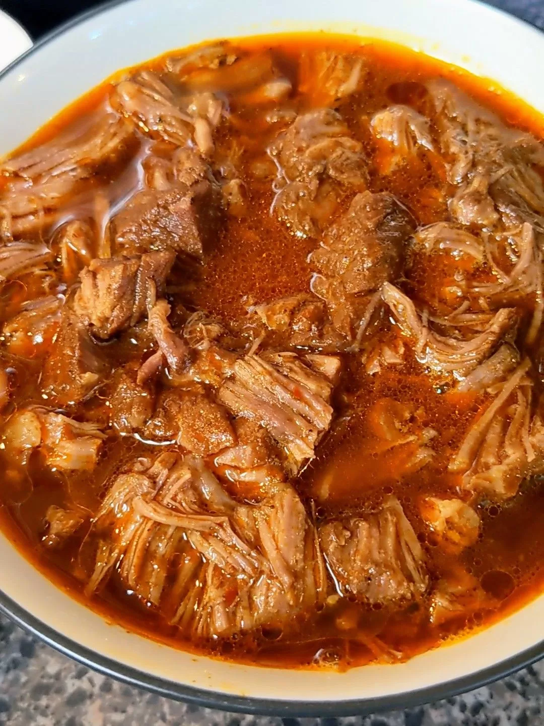 birria recipe in a bowl with consume